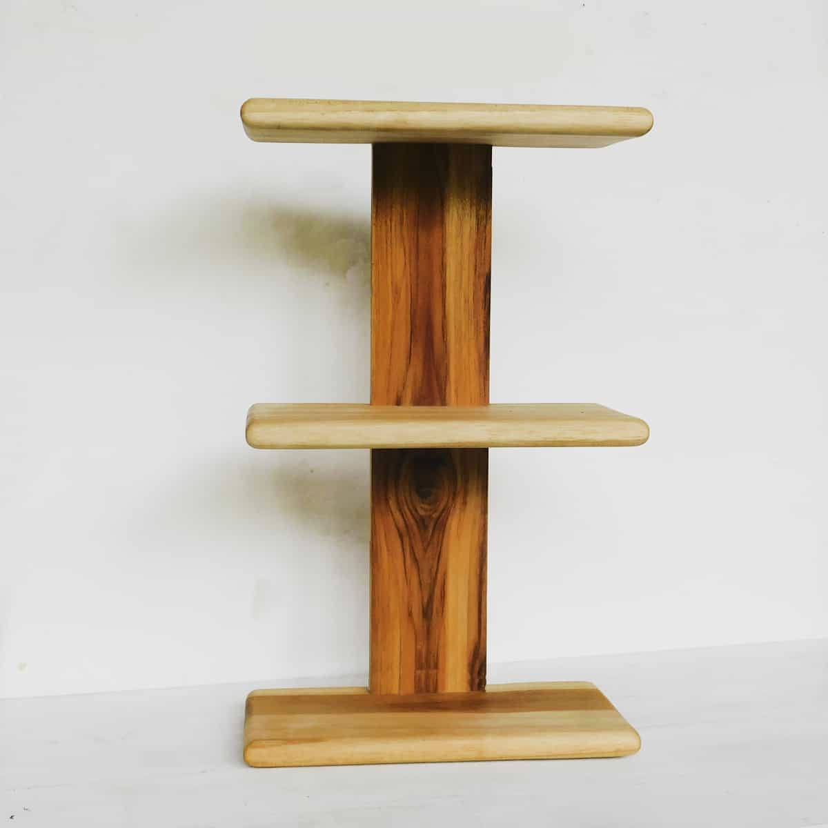  teak wood shelves in three tiers on a white background