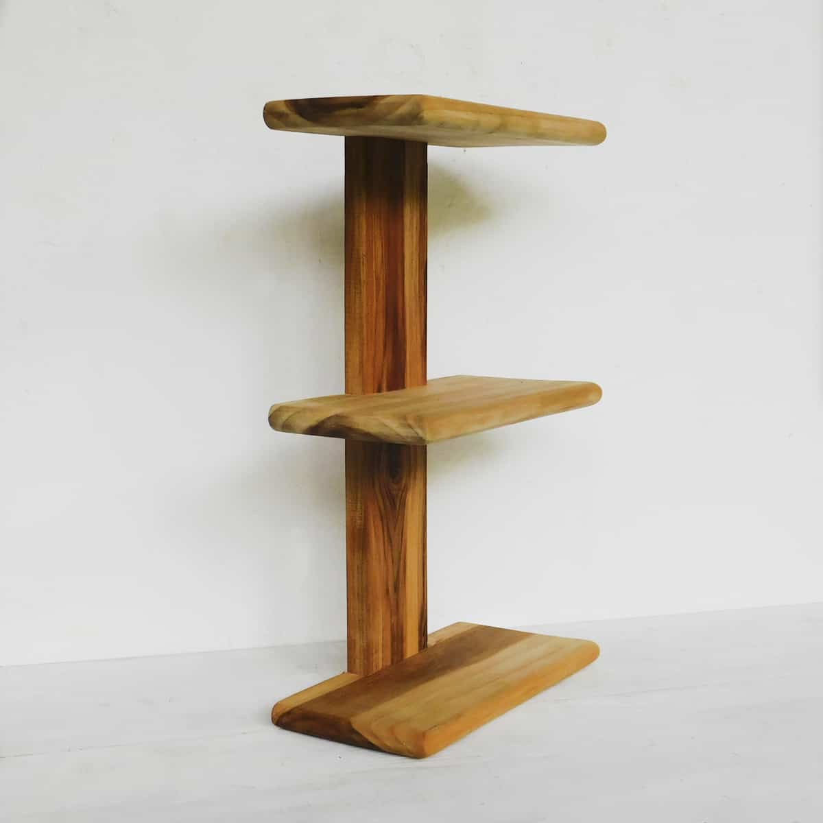 handmade teak shelves with three tiers seen from the side. handmade in guatemala.
