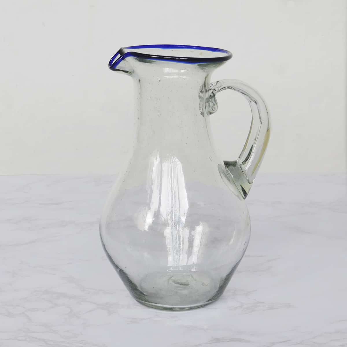 Blue Rim Hand Blown Glasses and Pitcher