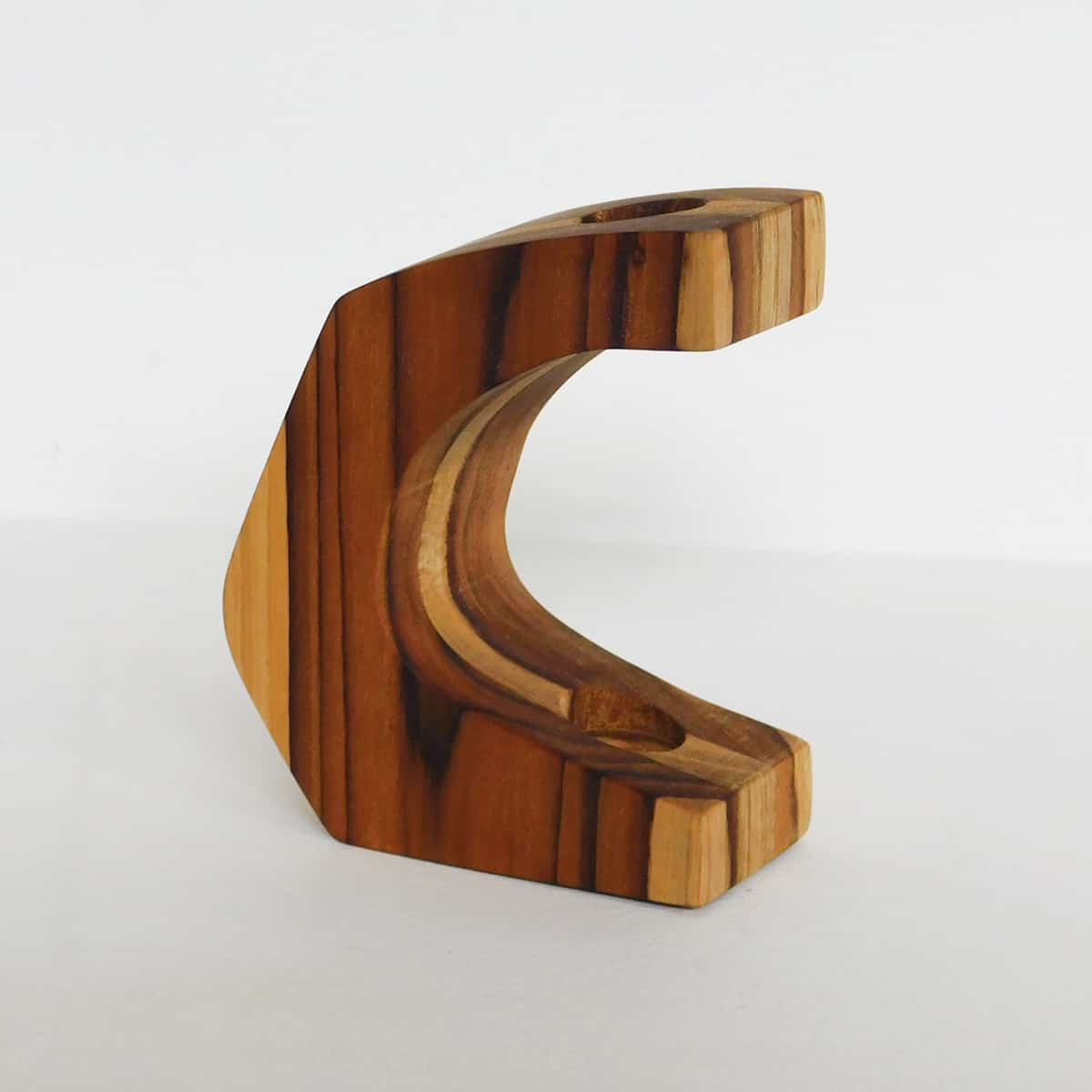  teak frame in the shape of the letter c with space for one tube vase on a white background